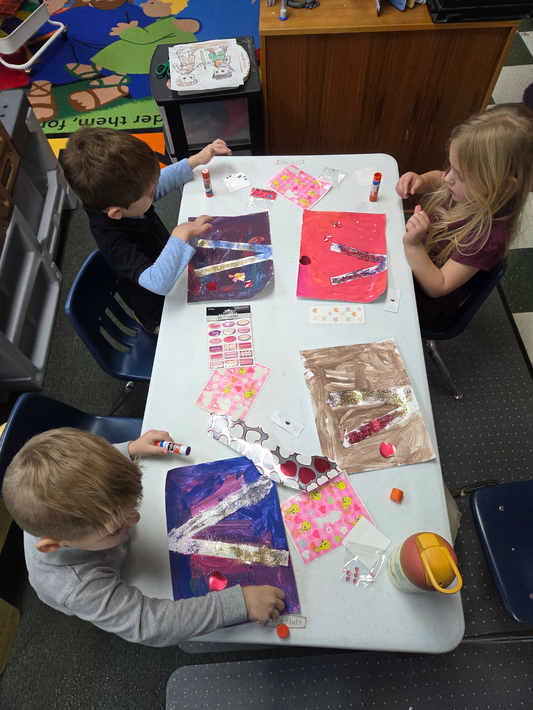 Students working on Valentine's Day art projects